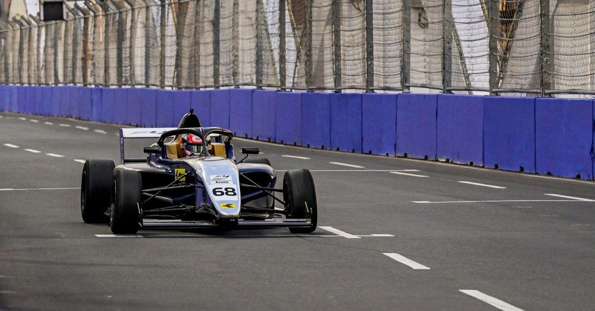 A single F4 Indian Championship car at speed