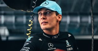 George Russell standing in the Mercedes garage in Hungary.