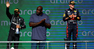 Lewis Hamilton and Max Verstappen on the podium with Shaquille O'Neill at the 2021 United States Grand Prix