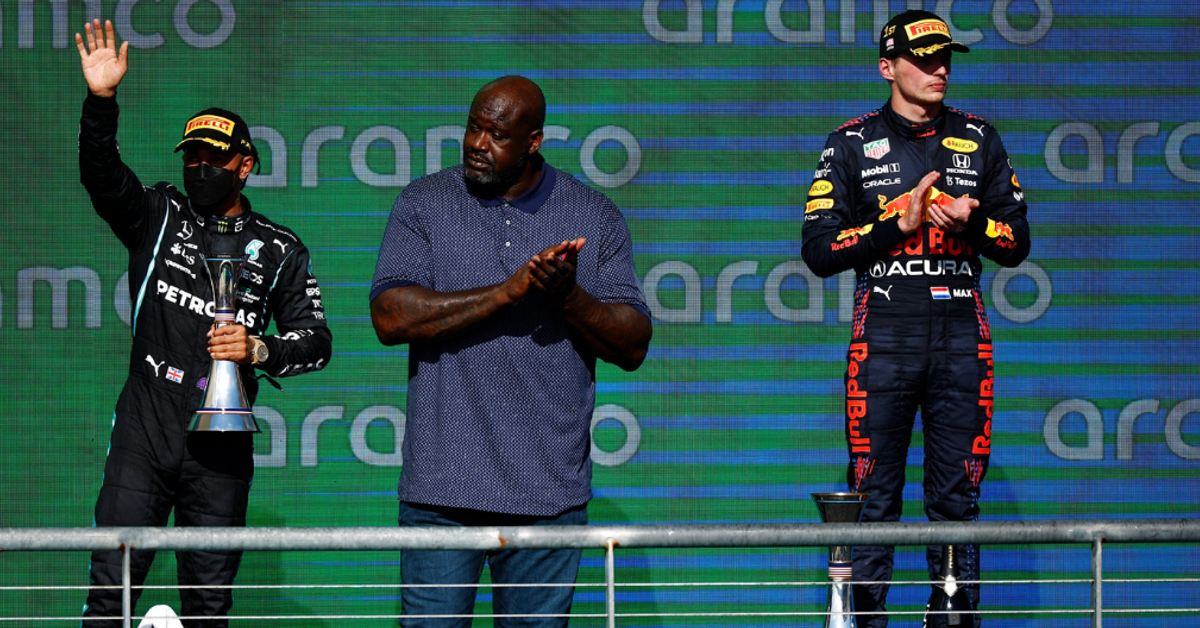 Lewis Hamilton and Max Verstappen on the podium with Shaquille O'Neill at the 2021 United States Grand Prix