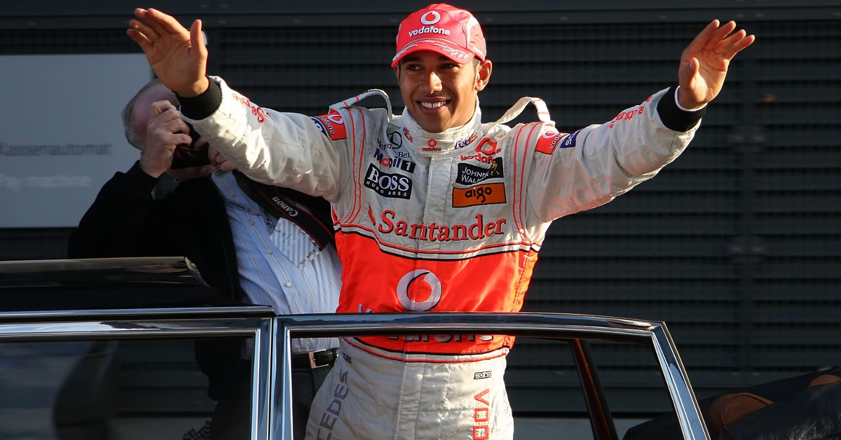 Lewis Hamilton with the Vodafone-Mercedes gear, waving to the fans