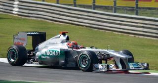 Michael Schumacher in the Mercedes MGP W02 in the first part of the Roggia chicane at Monza during second practice for the 2011 Italian Grand Prix.