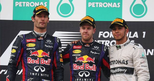 Race winner Sebastian Vettel (C) of Germany and Infiniti Red Bull Racing, second placed Mark Webber (L) of Australia and Infiniti Red Bull Racing and third placed Lewis Hamilton of Great Britain and Mercedes GP react on the podium following the Malaysian Formula One Grand Prix at the Sepang Circuit on March 24, 2013 in Kuala Lumpur, Malaysia. (Photo by Mark Thompson/Getty Images)