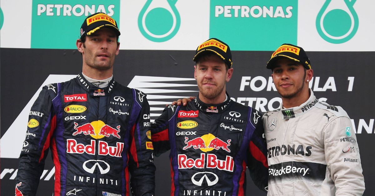 Race winner Sebastian Vettel (C) of Germany and Infiniti Red Bull Racing, second placed Mark Webber (L) of Australia and Infiniti Red Bull Racing and third placed Lewis Hamilton of Great Britain and Mercedes GP react on the podium following the Malaysian Formula One Grand Prix at the Sepang Circuit on March 24, 2013 in Kuala Lumpur, Malaysia. (Photo by Mark Thompson/Getty Images)