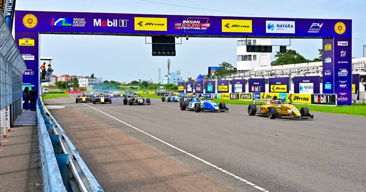 The F4 Indian Championship field streams away under the start gantry